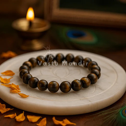 Natural tiger eye crystal bracelet shown in a second hand-held product view