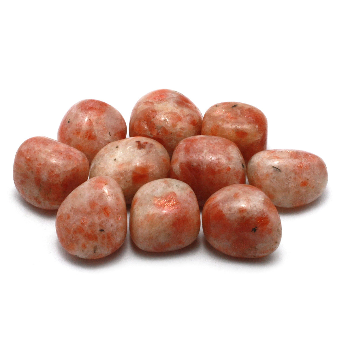 Small group of rounded sunstone tumbled stones isolated on a white background