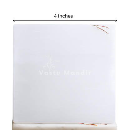 Plain square selenite plate in a close-up view against a clean white background