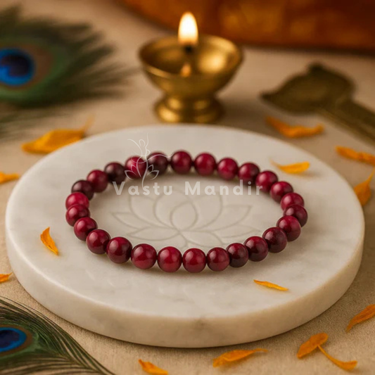 Natural pink tiger eye crystal bracelet shown with a hand in a lifestyle photograph