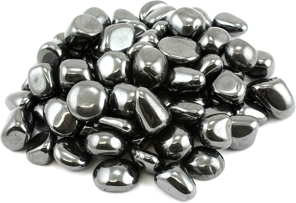 Pile of highly reflective metallic hematite stones isolated on a white background