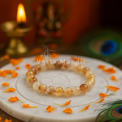 Natural citrine crystal bracelet shown in a second hand-held product view
