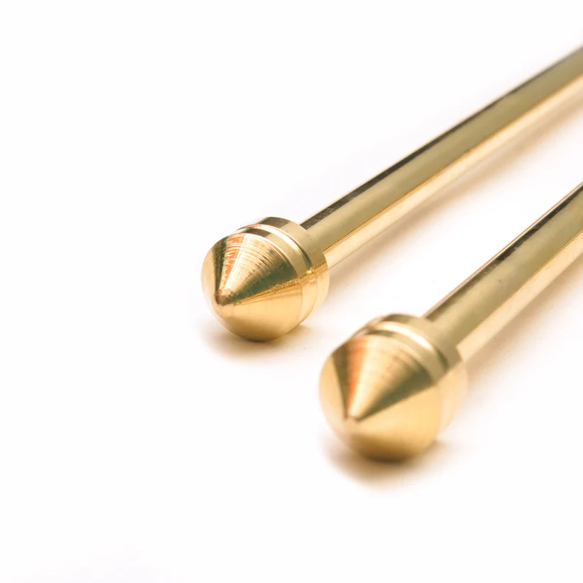 Close-up of pointed brass tips on the metal-handled dowsing rod pair