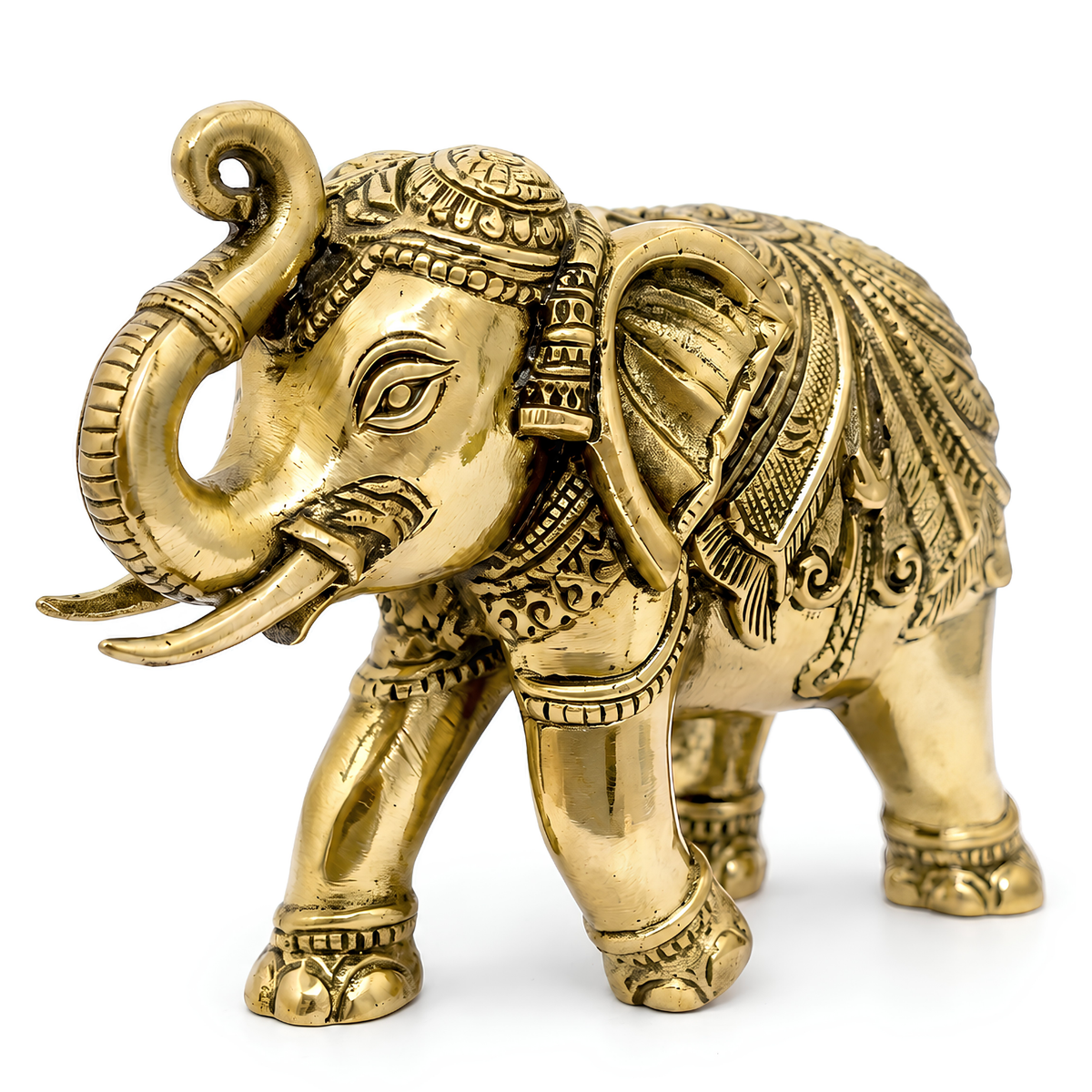 4-inch royal brass elephant figurine displayed on a decorative shelf in a neutral interior