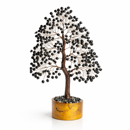 Black tourmaline crystal tree on a clean white background