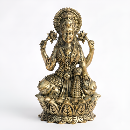 Brass Goddess Lakshmi idol front view isolated on white background