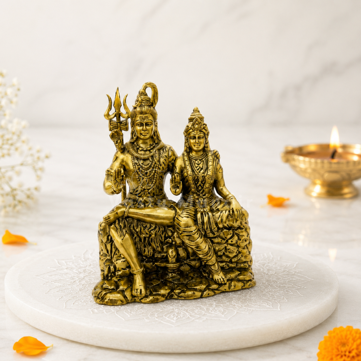 Brass Shiv Parvati idol close-up showing Shiva and Parvati with raised blessing hands