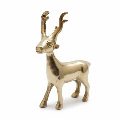 Brass deer figurine on a white background