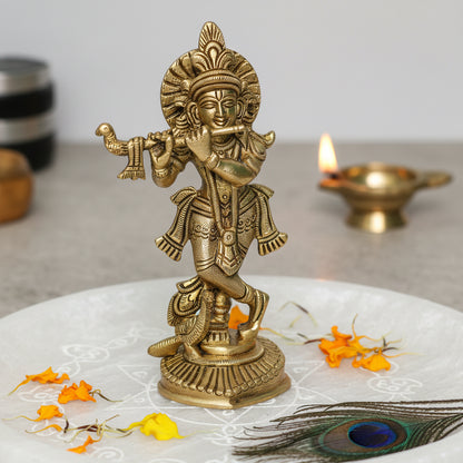 Brass Krishna Ji idol alternate front view on a white sacred platform