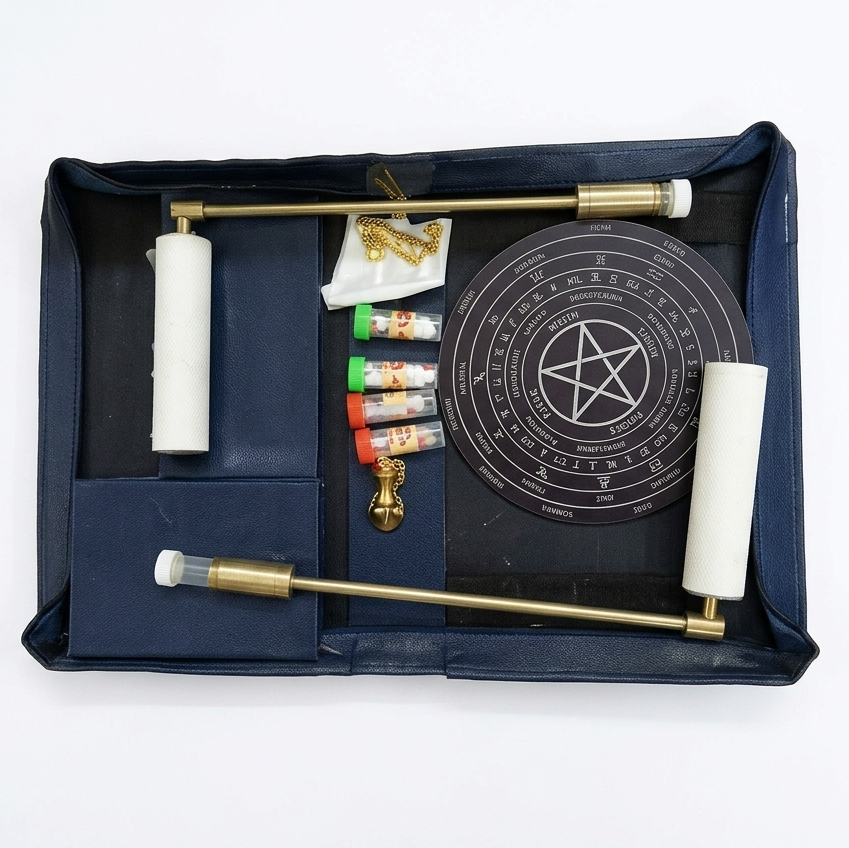Open brass leather dowsing kit isolated on white with all included tools visible
