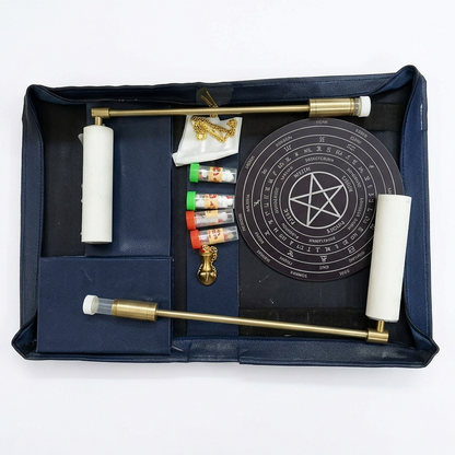 Open brass leather dowsing kit isolated on white with all included tools visible