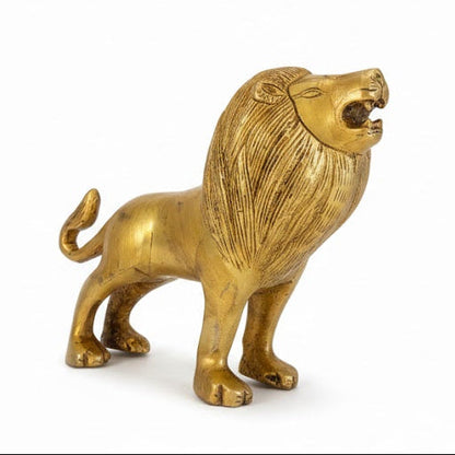 Gold lion figurine on a white background