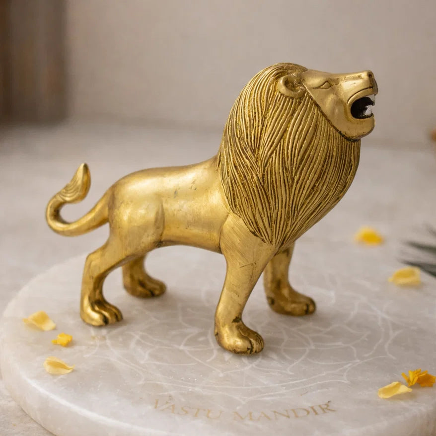 Brass Lion statue on a marble base with decorative elements