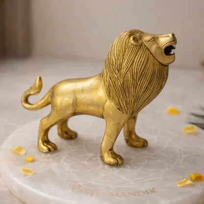 Brass Lion statue on a marble base with decorative elements