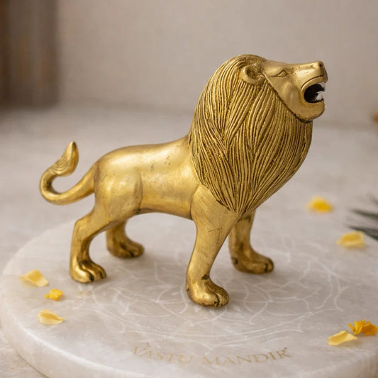 Brass Lion statue on a marble base with decorative elements