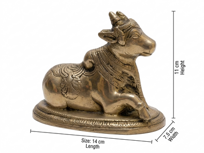 Decorative brass bull statue with measurements on a white background