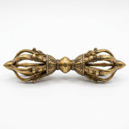 Brass Vajra Dorje ritual tool horizontal view isolated on white background