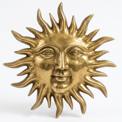 Brass sun-shaped decorative item on a white background
