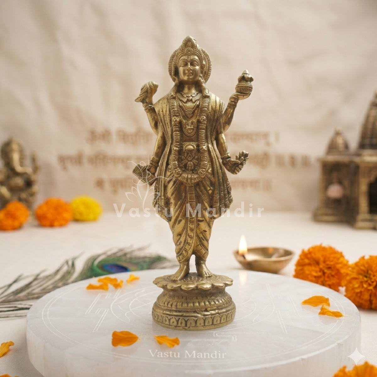 Brass Dhanvantri idol alternate front angle on a white platform with ritual accents
