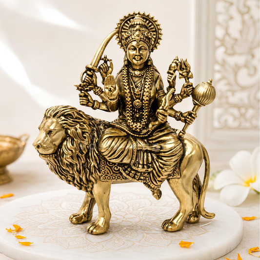 Durga Mata Ji brass idol front view on a sacred white pedestal with floral accents