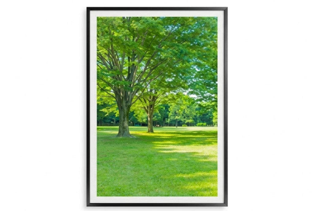Framed print of a green landscape with trees and grass.