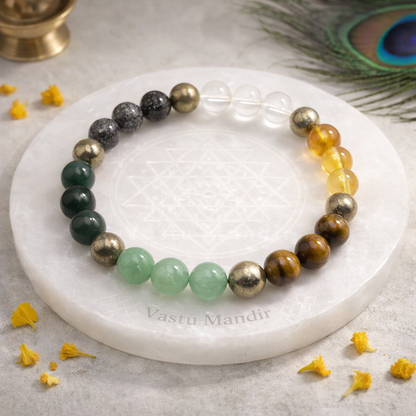 Money Magnet Bracelet — 8mm Beads on a white stone surface with 'Vastu Mandir' branding.
