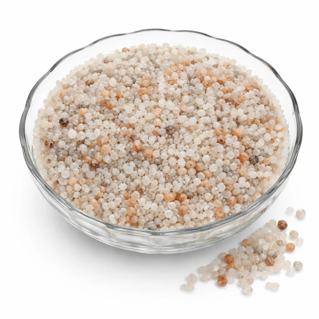 Pile of moonstone crystal chips on a clean white background