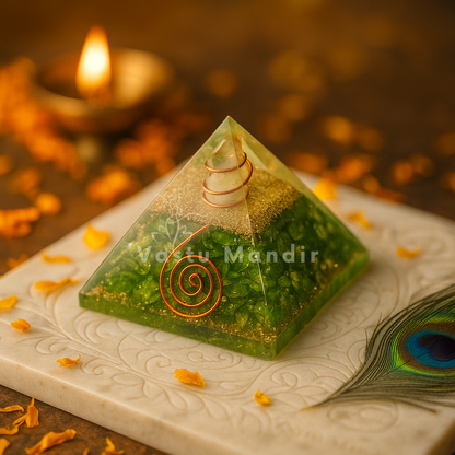 Natural Peridot Pyramid Vastu Remedy with a spiral design on a decorative surface with a candle and peacock feather.
