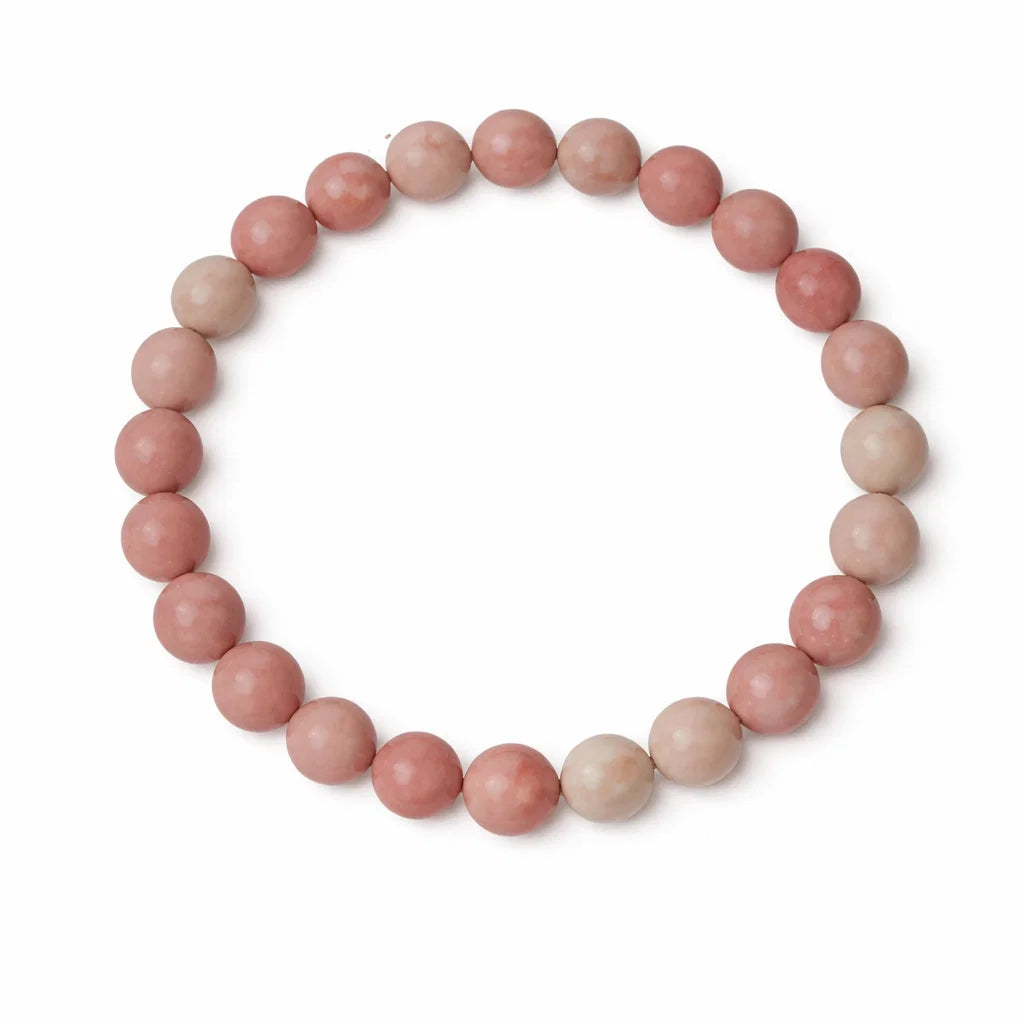 Natural Rhodochrosite Crystal Bracelet beads on a white background