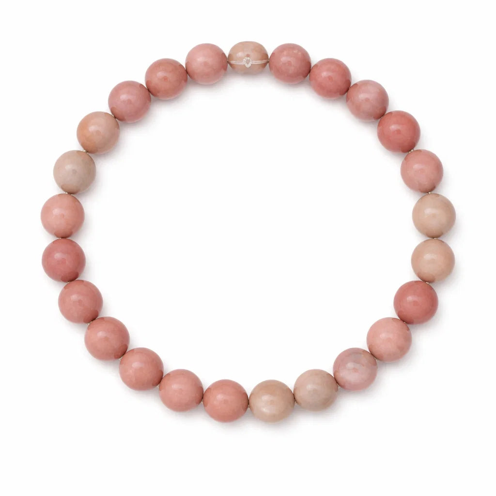 Natural rhodochrosite bracelet shown in a full circular view on white