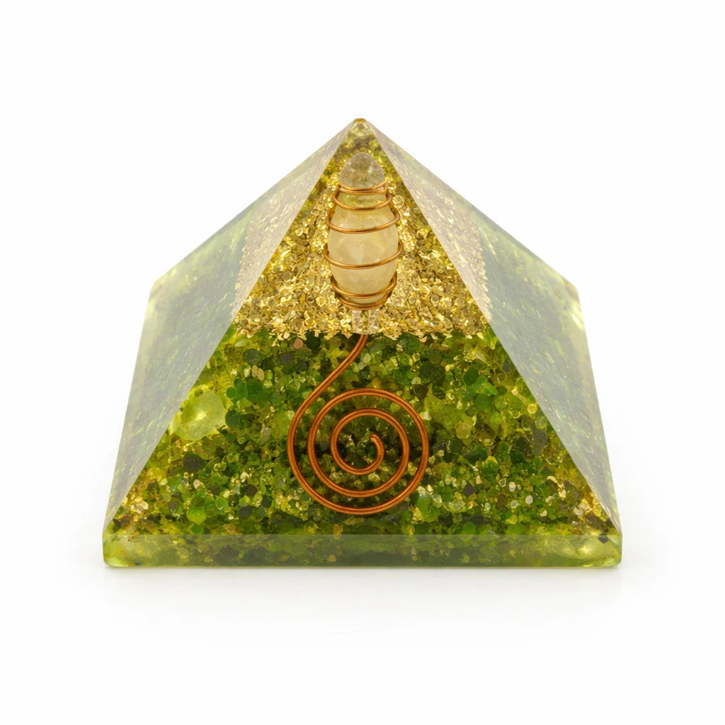 Peridot Orgonite Pyramid with green stone, gold accents, and a copper coil on a white background