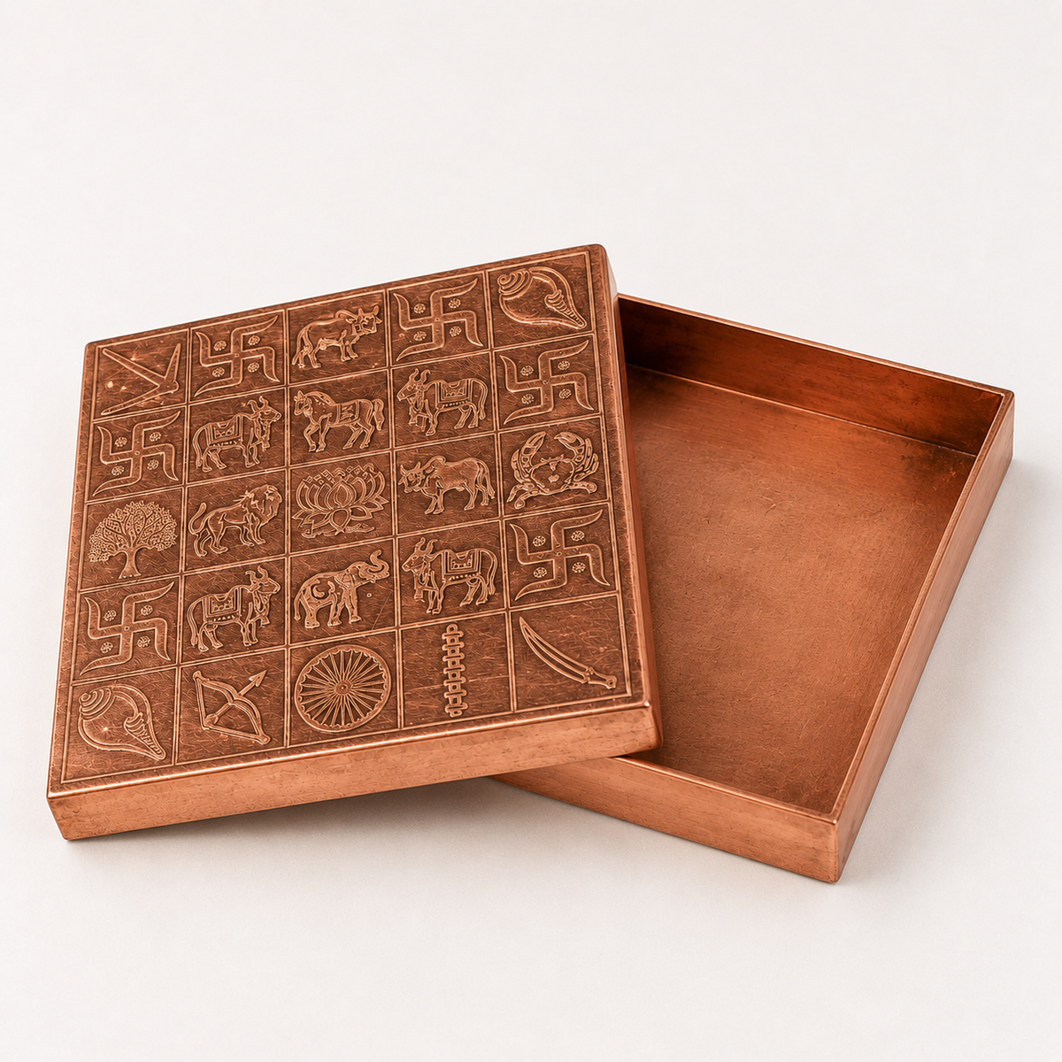 Copper Manjusha box with lid opened to show the interior arrangement