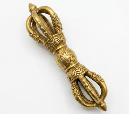 Large pure brass Vajra Dorje isolated diagonally on white background