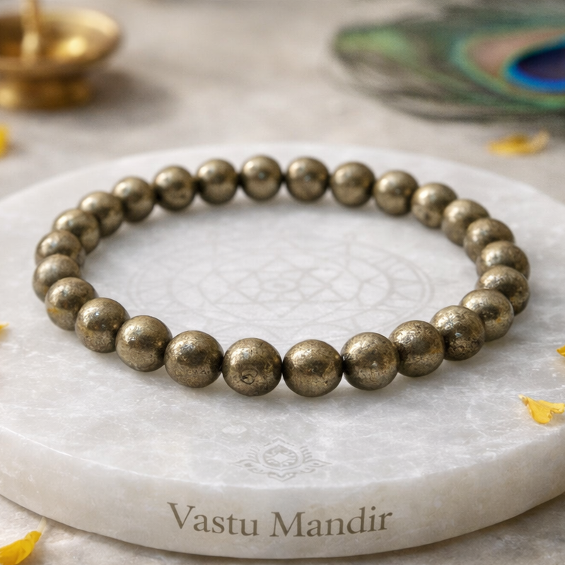 Pyrite Bracelet — 8 mm Beads on a marble coaster with 'Vastu Mandir' branding