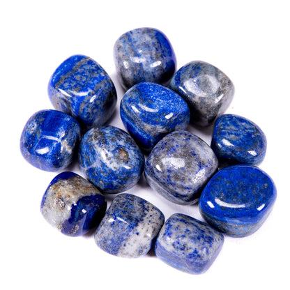 Polished lapis lazuli stones grouped on a clean white background