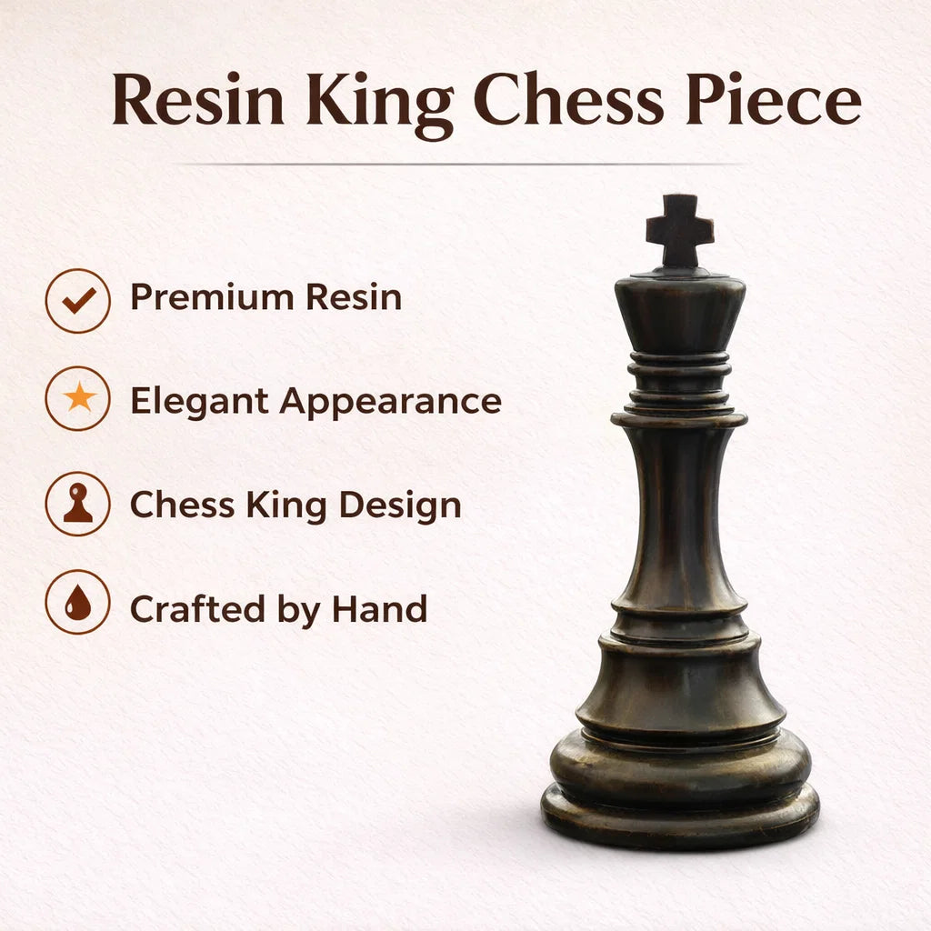 Black king chess piece resin sculpture with gold crown detailing