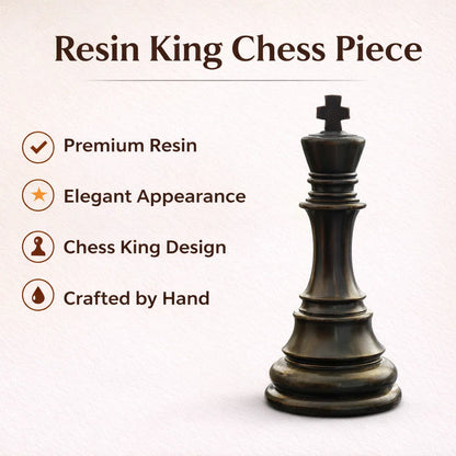 Black king chess piece resin sculpture with gold crown detailing