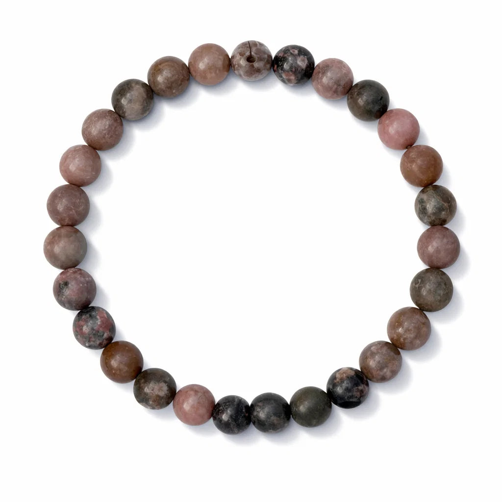 Close-up of Natural Rhodonite Crystal Bracelet showing pink and black polished beads