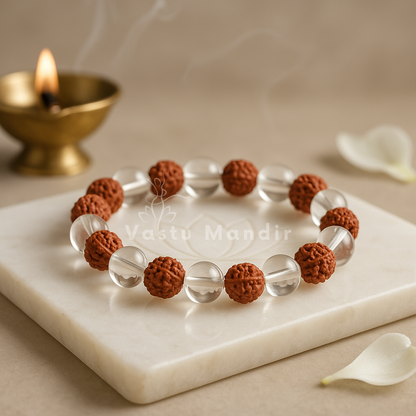 Rudraksha Clear Quartz Crystal Bracelet on a marble surface with 'Vastu Mandir' branding.