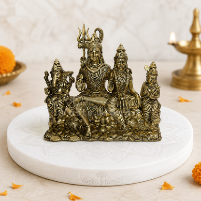 Shiv Parivar brass idol alternate front angle on a styled platform