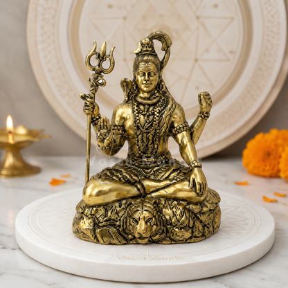 Brass Lord Shiv Ji idol alternate front angle on a styled pedestal