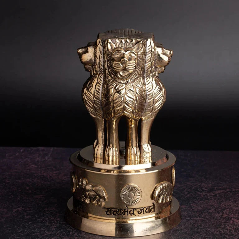Brass Ashoka Stambh idol displayed against a dark studio background