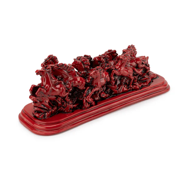 Twelve red running horses resin sculpture on a white background, right three-quarter view