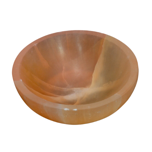 Orange round selenite charging bowl on a clean white background
