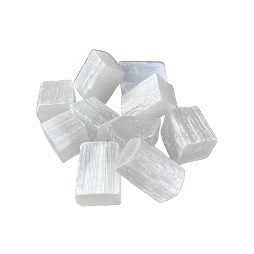 Small translucent selenite rods and cubes isolated on a clean white background