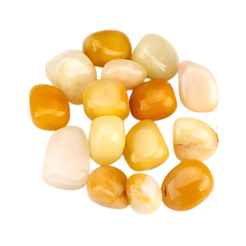Mixed cream and yellow jade stones grouped on a clean white background
