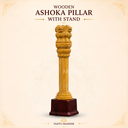 Wooden Ashoka pillar displayed with traditional brass décor
