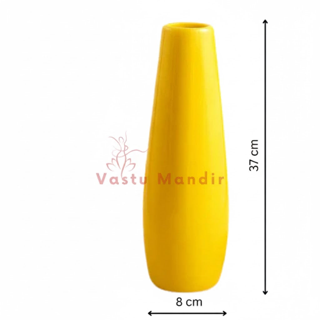 Large yellow resin vase photographed as a decorative home accent