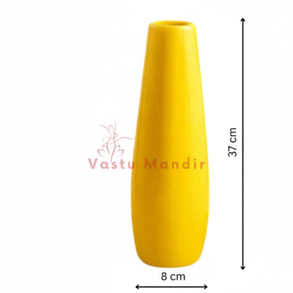 Large yellow resin vase photographed as a decorative home accent