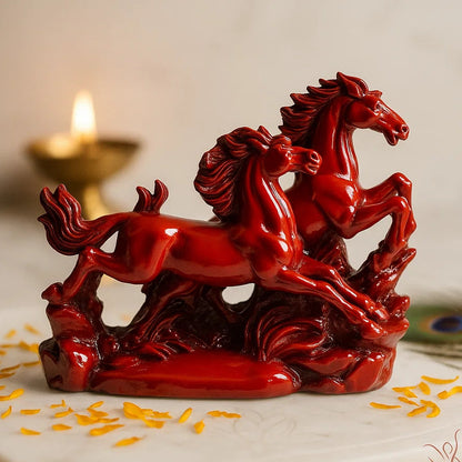 Side perspective of red running horses pair decorative figurine